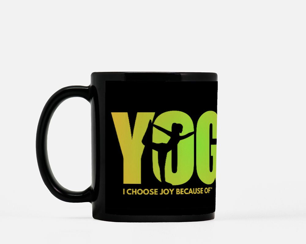 Black mug with green text and silhouette of a person in a yoga pose on a white background